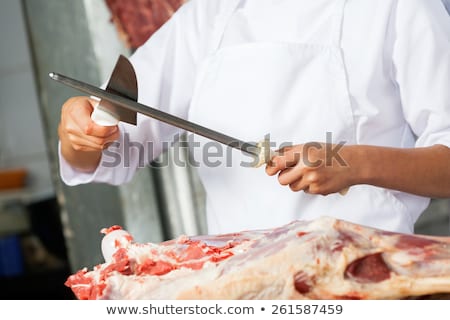 Stok fotoğraf: Butcher Sharpening A Knife