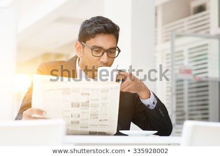 Young Business Man Is Reading Newspaper Outdoor Foto d'archivio © szefei