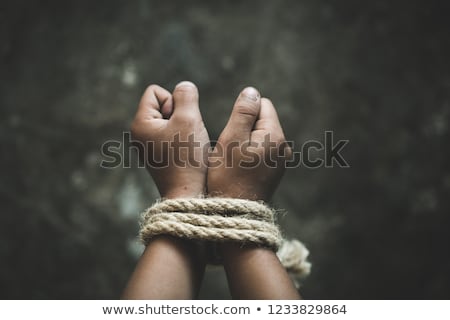Stock photo: Hands Tied Up With Rope