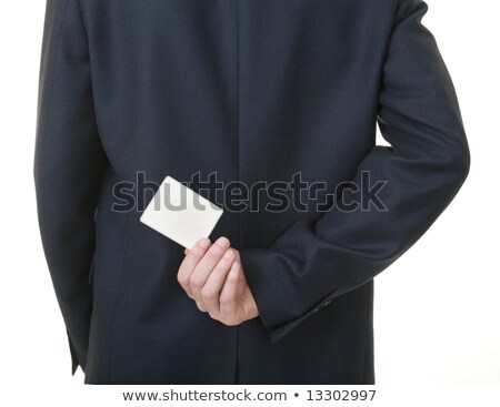 ストックフォト: Man Holding Blank Business Card Behind His Back