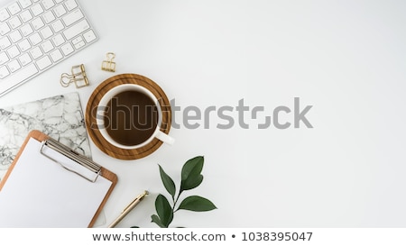 Foto stock: Laptop With Coffee Cup And Notepad On Desk