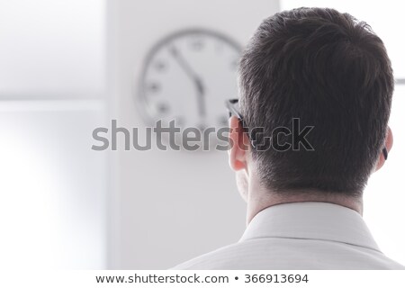 Foto d'archivio: Businessman Staring At The Clock