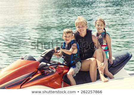 Foto stock: A Group Of People Enjoying The Watersport Activities