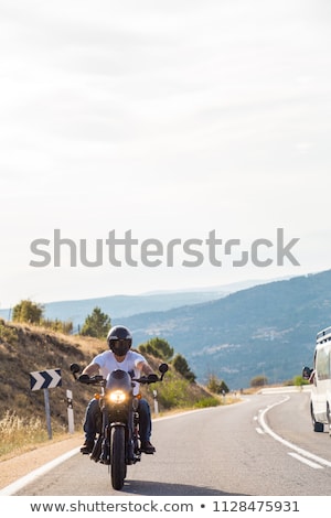 Stockfoto: Young Brutal Man Driving A Motorcycle
