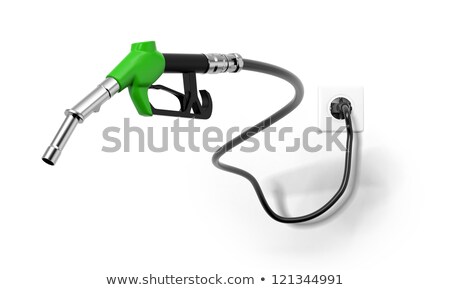 Сток-фото: Green Fuel Nozzle From Electrical Outlet