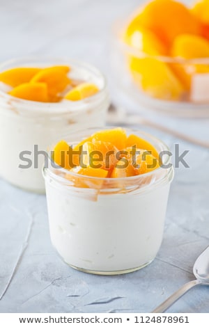 Foto stock: Cups Of Yogurt With Poached Peach