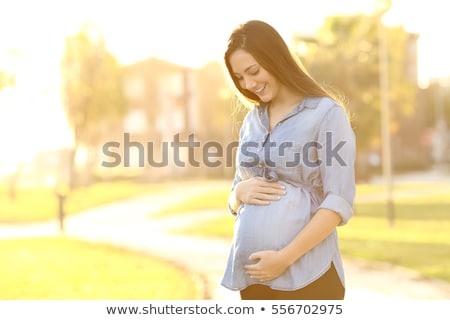 Zdjęcia stock: Portrait Of A Happy And Proud Pregnant Woman On Urban Background