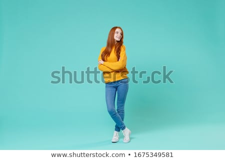 Сток-фото: Portrait Of Redhead Young Woman Holding Hair