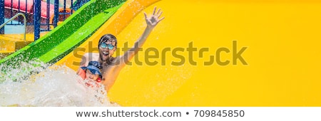 Сток-фото: Banner Father And Son On A Water Slide In The Water Park Long Format