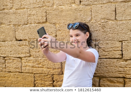 ストックフォト: Teenage Girl Taking Selfie By Smartphone