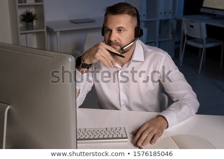 Zdjęcia stock: Serious Customer Support Representative Concentrating On Question Of Client