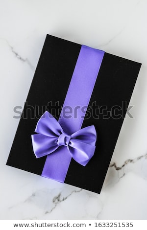 Foto stock: Luxury Holiday Gifts With Lavender Silk Ribbon And Bow On Marble