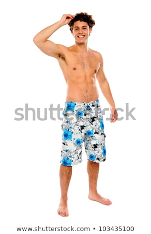 Молодой человек на пляже в костюме Сток-фото © stockyimages