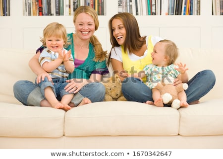 Stockfoto: Young Mother Plays The Gay Son