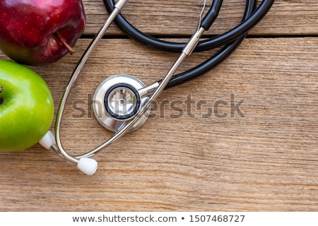 Stock foto: Green Ripe Apple And Stethoscope