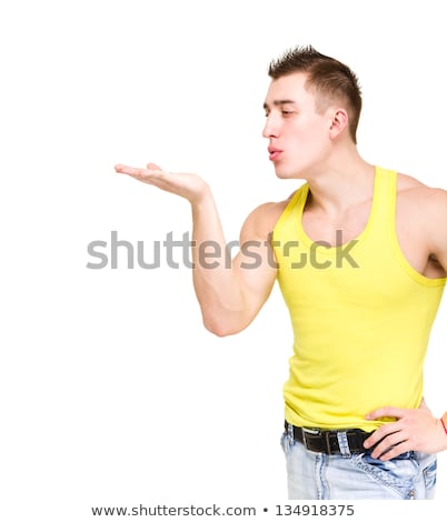 Young Muscular Man Blowing Kiss Over White Foto d'archivio © StepStock