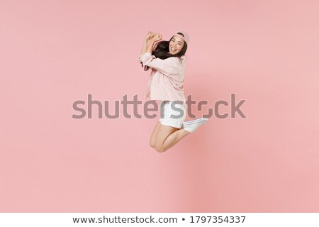 Foto d'archivio: Side View Asian Woman Jumping
