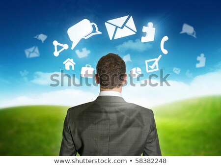 Businessman Looking At Email Symbol Zdjęcia stock © solarseven