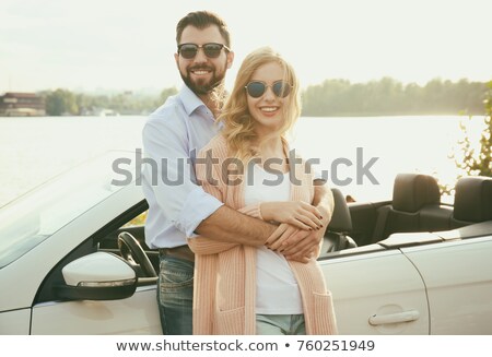 Stock photo: Happy Young Couple In Sunglasses Driving Cadriolet