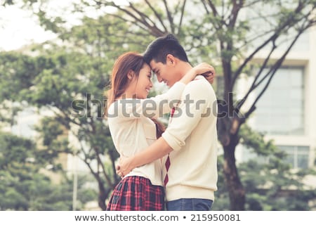 Foto stock: Affectionate Couple Embracing Each Other In Park