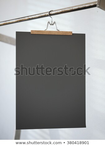 [[stock_photo]]: Trouser Hanger With Black Paper Sheet 3d Rendering