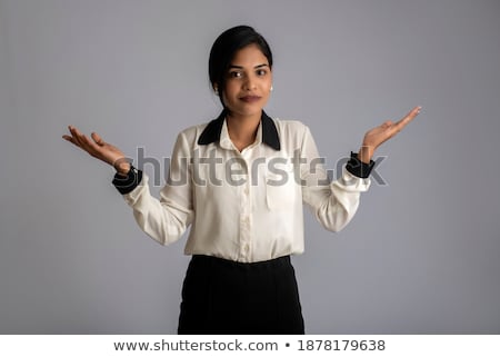 Stockfoto: Indian Attractive Young Lady Presenting Something