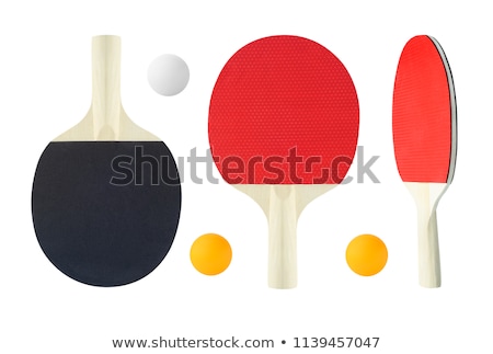 Red tennis ping pong rackets and orange ball isolated on a red background,  sport equipment for table tennis Stock Photo