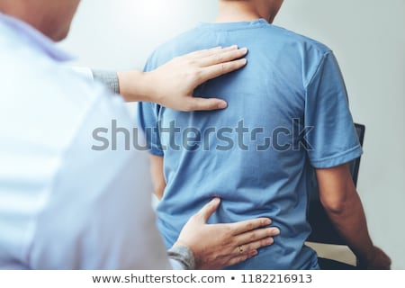 Stockfoto: Doctor Consulting With Patient Back Problem