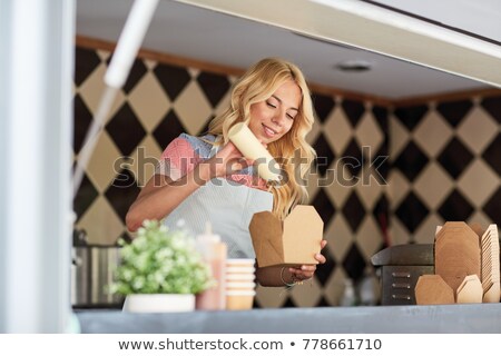 Stockfoto: Happy Saleswoman Making Wok At Food Truck