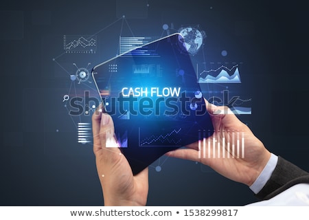 Foto stock: Businessman Holding A Foldable Smartphone Business Concept
