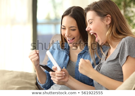 Foto stock: Teenager Are Excited About Their Smartphone Content