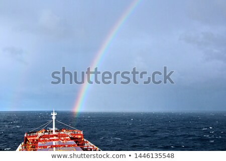 Foto stock: Cargo Ship Against Blue Sky