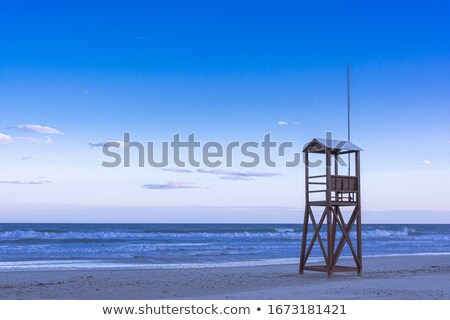 Stok fotoğraf: Sand And Beach With Observation And Rescue Tower