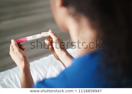 Stok fotoğraf: Woman Holding Negative Pregnancy Test Kit