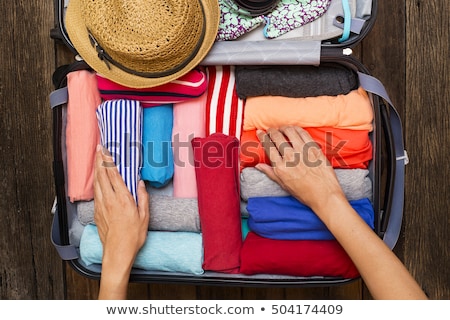 Stockfoto: Woman Hand Packing A Luggage For A New Journey And Travel For A