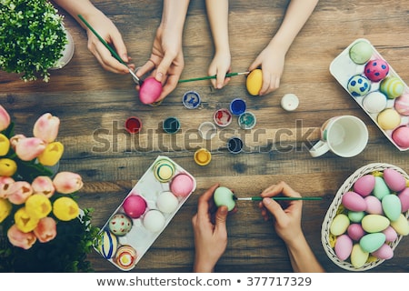 Foto stock: Happy Easter A Beautiful Child Girl Painting Easter Eggs Happy Family Preparing For Easter