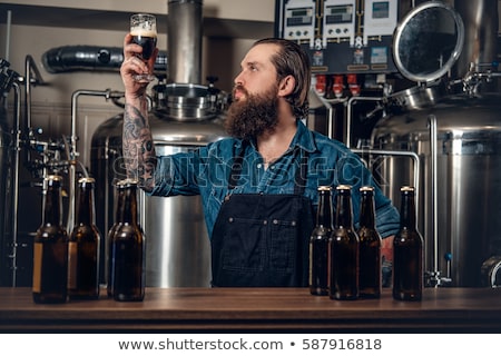 Сток-фото: Men Drinking And Testing Craft Beer At Brewery