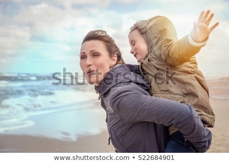 Stock photo: Happy Family Running Along Autumn Beach