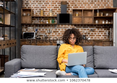 Foto stock: Black Woman Working From Home With Laptop Computer