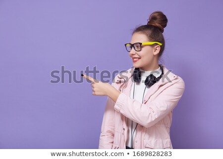 Stock photo: Woman Wearing Headphones Making Youthful Gesture