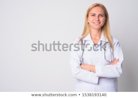 Stok fotoğraf: Young Blonde Attractive Doctor With Arms Crossed
