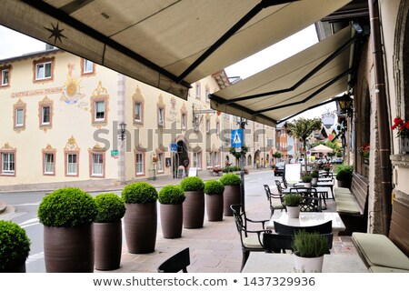 Foto stock: Bistro Restaurant With Awning Table And Chairs