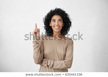 Foto stock: Attractive Girl Pointing Above Her Head