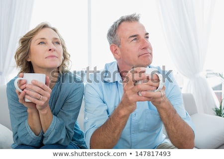 Stock photo: Couple Day Dreaming And Smiling