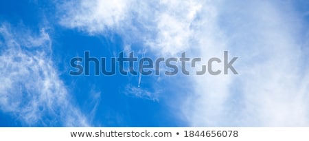 Stockfoto: Condensation Trail On Blue Sky