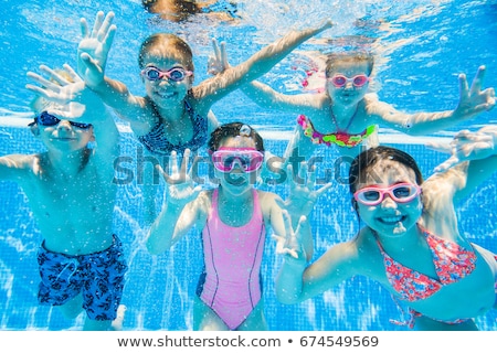 Сток-фото: Caucasian Boy With Diving Goggles At Swimming Pool