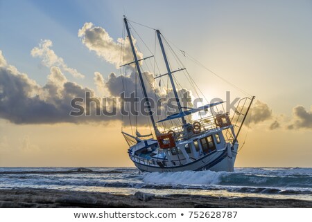 Stok fotoğraf: Wrecked Boat Abandoned Stand On Beach In Rhodes Greece