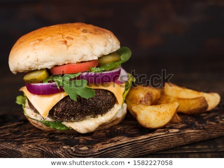 Сток-фото: Fresh Organic Beef Burger With Cheese And Sauce With Vegetables And Potato Vedges On Wooden Board