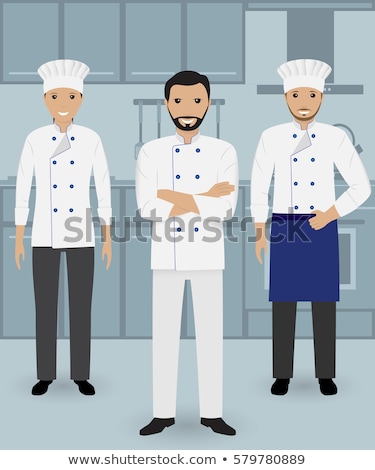 Stok fotoğraf: Two Male Chefs Standing With Arms Crossed In Kitchen At Hotel
