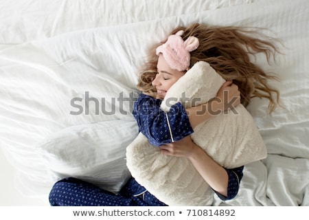 Stok fotoğraf: Pretty Blonde Hugging Her Pillow In The Morning